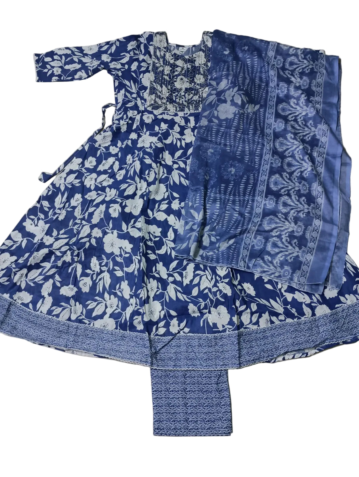 Blue and white floral patterned outfit on a gray surface