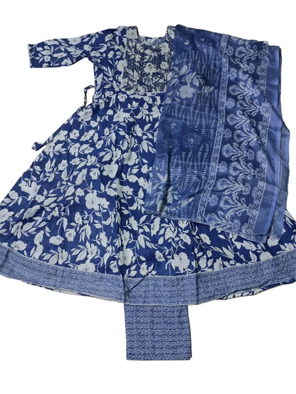 Blue and white floral patterned outfit on a gray surface