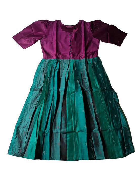 Two-tone dress with purple top and green skirt on a light gray background