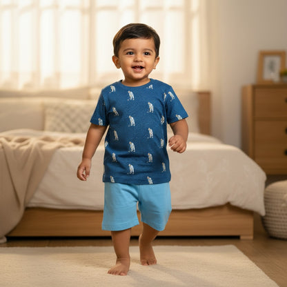 kidshe baby boy set with a blue patterned t-shirt and light blue shorts worn by a toddler in a bedroom
