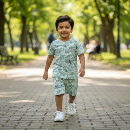 kidshe 3-4 year old boy wearing a light green coord set with vintage airplane print walking in a park