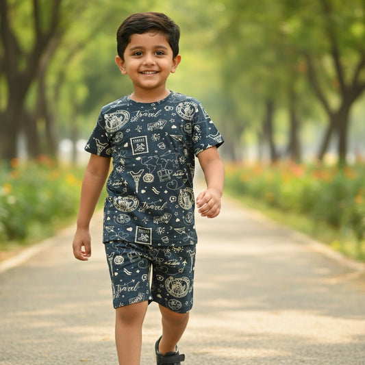 kidshe boy coord set featuring a navy blue t-shirt and shorts with a white travel-themed print worn by a young boy
