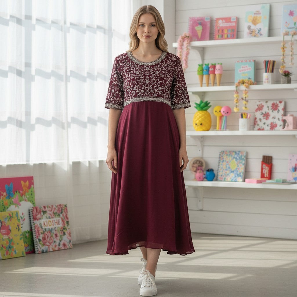 kidshe dark pink Anarkali dress with intricate silver embroidery on the bodice and sleeves.