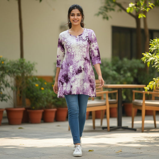 kidshe purple and white tie-dye short top with white floral embroidery on the yoke and 3/4 sleeves.